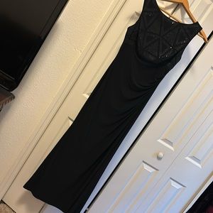 Beautiful, lightly beaded bodice.Partial open back; has stretch to it.